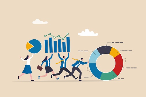 Business people holding graphs and pushing a wheel chart to represent RDEC tax credits